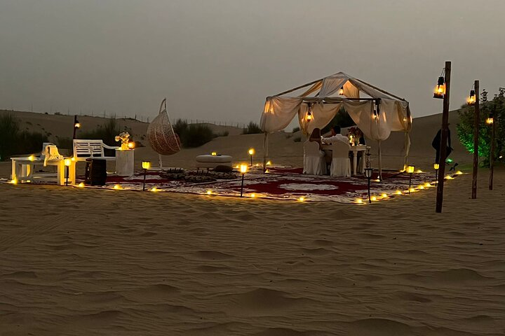 Experience the serene beauty of the desert with a private tent setup perfect for cozy evenings. Enjoy camel rides dune bashing and a magical night under the stars with loved ones.